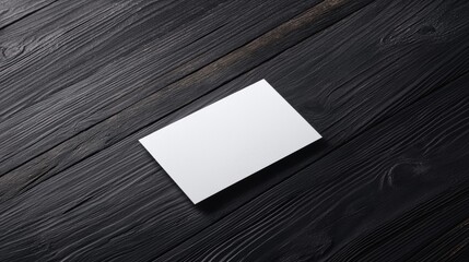 Wall Mural - Blank business card on dark wooden surface