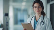 © sabyna75 - Young doctor holding clipboard in hospital hallway for medical consultation concept