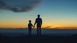 © andyaziz6 - Father and Son Watching Sunset: A Silhouette of Shared Moments Against City Lights and Mountains