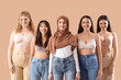 © Pixel-Shot - Group of young women on beige background