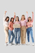 © Pixel-Shot - Group of young women holding cardboard with text WOMAN POWER on light background