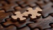 © Tati - Two wooden puzzle pieces fitting together on dark surface, symbolizing connection and teamwork