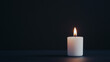 © pattozher - Single Candle Glow: A single white candle illuminates the darkness, casting a warm, inviting glow against a deep black background. Its flickering flame symbolizes hope, remembrance.