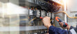 © A Stockphoto - Checking the electrical system, an electrician is using an electric meter to check the electrical system at a control cabinet. for safety