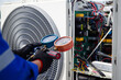 © A Stockphoto - Air conditioner service .The air conditioner technician is using a gauge to measure the refrigerant pressure. air compressor.