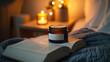 © Cozy Art - Candle and face cream jar on cozy bedside table