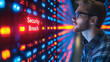 © CreativeIMGIdeas - Security Breach Alert: A focused IT specialist intently examines a server rack displaying a critical 'Security Breach' alert, highlighting the urgency and tension of a cybersecurity crisis.