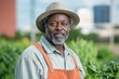 © ChaoticMind - An older gardener in orange overalls and a straw hat holds freshly picked greens, standing against an urban skyline, embodying urban agriculture and resilience.