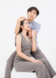 © Bangkok Click Studio - Portrait of young asian happy attractive cheerful couple love, Joyful sweethearts hugging embracing cuddle enjoy good time romantic date, posing to camera smiling sitting together on white background
