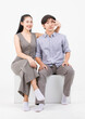 © Bangkok Click Studio - Portrait of lovely young asian happy attractive cheerful couple love, Joyful sweethearts enjoy good time romantic date, sitting on a box posing to camera smiling against together on white background.