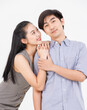 © Bangkok Click Studio - Portrait of young asian happy attractive cheerful couple love, Joyful sweethearts embracing cuddle enjoy good time romantic date, posing to camera smiling together on white background Valentine's Day
