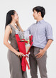 © Bangkok Click Studio - Portrait of young asian happy attractive cheerful couple love Joyful sweethearts holding bouquet of red roses for Valentine's day enjoy good time romantic posing to camera smiling on white background.