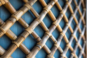 Leinwandbilder - This artistic bamboo lattice captures depth and perspective with its structured design. The neatly woven bamboo creates a dynamic and visually appealing texture.