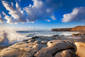 Wall Mural - Waves crashing onto petrified lava at La Pared, Fuerteventura