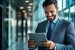 © DNY3D - Smiling businessman increasing productivity with a tablet in a sleek modern office