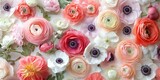 Colorful floral flat lay featuring soft pink, peach, white ranunculus and anemone flowers arranged over a light background with ample copy space.