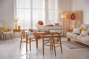 Poster - Stylish table setting with beautiful dishware and autumn decor in dining room