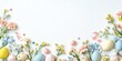 © Lala - Soft pastel Easter backdrop with decorated eggs, flowers, candy, and ribbons positioned along the bottom against a white background with ample copy space.