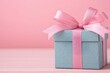 © Arfa_Media - Pastel blue gift box with pink ribbon bow on pink background