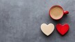 © Arfa_Media - Celebrating Valentine's Day with coffee and heart-shaped gifts on a gray background
