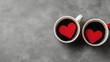 © Arfa_Media - Two coffee mugs with red hearts floating celebrating Valentine's Day
