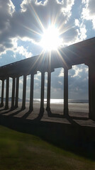 Wall Mural - Sunlit Pier Columns Beach Photo