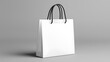 © PPS - White Paper Shopping Bag Mockup on Grey Background
