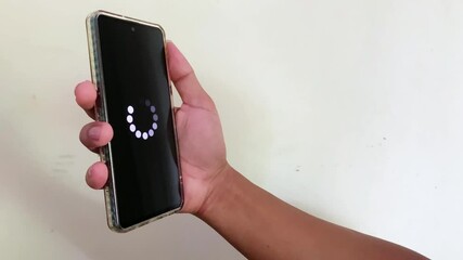 System error, slow loading, no connection to wifi on mobile smartphone screen in man hand. No signal internet connection on cellphone. System software update and upgrade loading process.