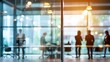 © Iman00 - A blurred, interior business people at tables through a glass wall. This appears to be an office setting