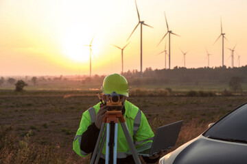 Fototapete - Survey Team Alternative energy for future. Engineers survey and checking wind turbines in sunset. Wind Turbine Renewable energy technology and sustainability.