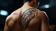 © KHOLIS - A man with a sun tattoo on his back
