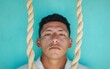 © Ryzhkov - Contemporary Portrait of a Man Framed by Ropes Against Aqua Background