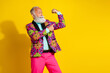 © deagreez - Photo portrait of attractive retired man point look flexing muscles dressed colorful pink fancy clothes isolated on yellow color background
