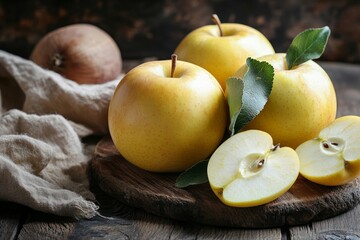 Wall Mural - Close up of ripe yellow apples on wooden rustic table creating appetizing look