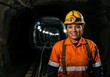 © Jenny - Hispanic female miner smiling in orange safety gear in underground tunnel