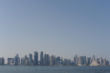 Wall Mural - Panoramic view of modern skyscrapers of Doha capital city cityscape on a sunny day in summer, Doha, Qatar