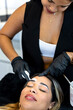 © Alfonso Soler - Professional eyebrow beautician. Eyebrow cleaning in a beauty clinic. Latin character.