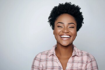 Wall Mural - Woman with a smile on her face is wearing a pink plaid shirt