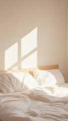 Fototapete - Warm sunlight casts shadows from the window onto an unmade bed with white linens in a hotel room, creating a peaceful and relaxing atmosphere perfect for a summer holiday