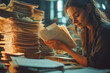 © MVProductions - Office employee working with documents at table, closeup, businesswoman working with stacks of paper files in the office, with copy space.