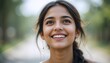 © AKSNA - Potrait Of Young Indian Woman with Radiant Smile and Bright Eyes, Capturing Carefree Joy and Gentle Beauty With a Neutral Background