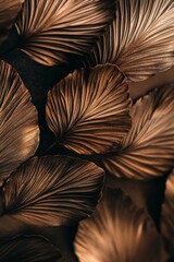 Aufkleber - Close-up of bronze-toned palm leaves, overlapping, textured, dark background.