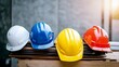 © JINGWEN - Construction helmets in different colors, representing the diversity and safety gear used by workers on job sites.
