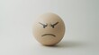 © marfuah - Angry egg emoticon on white background.