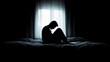 © Julia - Desperate man in silhouette sitting on the bed alone. masculinity and emasculation concept.