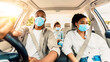 © Prostock-studio - African American Family Wearing Face Masks Riding Car Traveling By Auto. Covid-19 Pandemic Outbreak And Coronavirus Protection. Safe Summer Road Trip During Epidemic Concept. Panorama