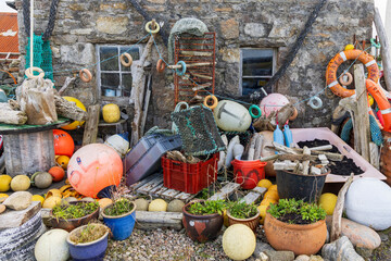 Wall Mural - Scotland, Hebrides. Isle of Lewis, Barvas. Shop with old buoys and other fishing items and antiques.