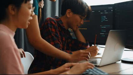 Slow motion back end software developer engineer for computer programming working together on debugging writing computing code, solving complex algorithms display on monitor in office. Burgeoning