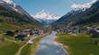 © ศุภมาส - A river runs through a valley with houses on either side