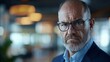 © InspirationDesign - Senior businessman with stern expression. Ideal for executive authority, professional experience, or leadership presence content.